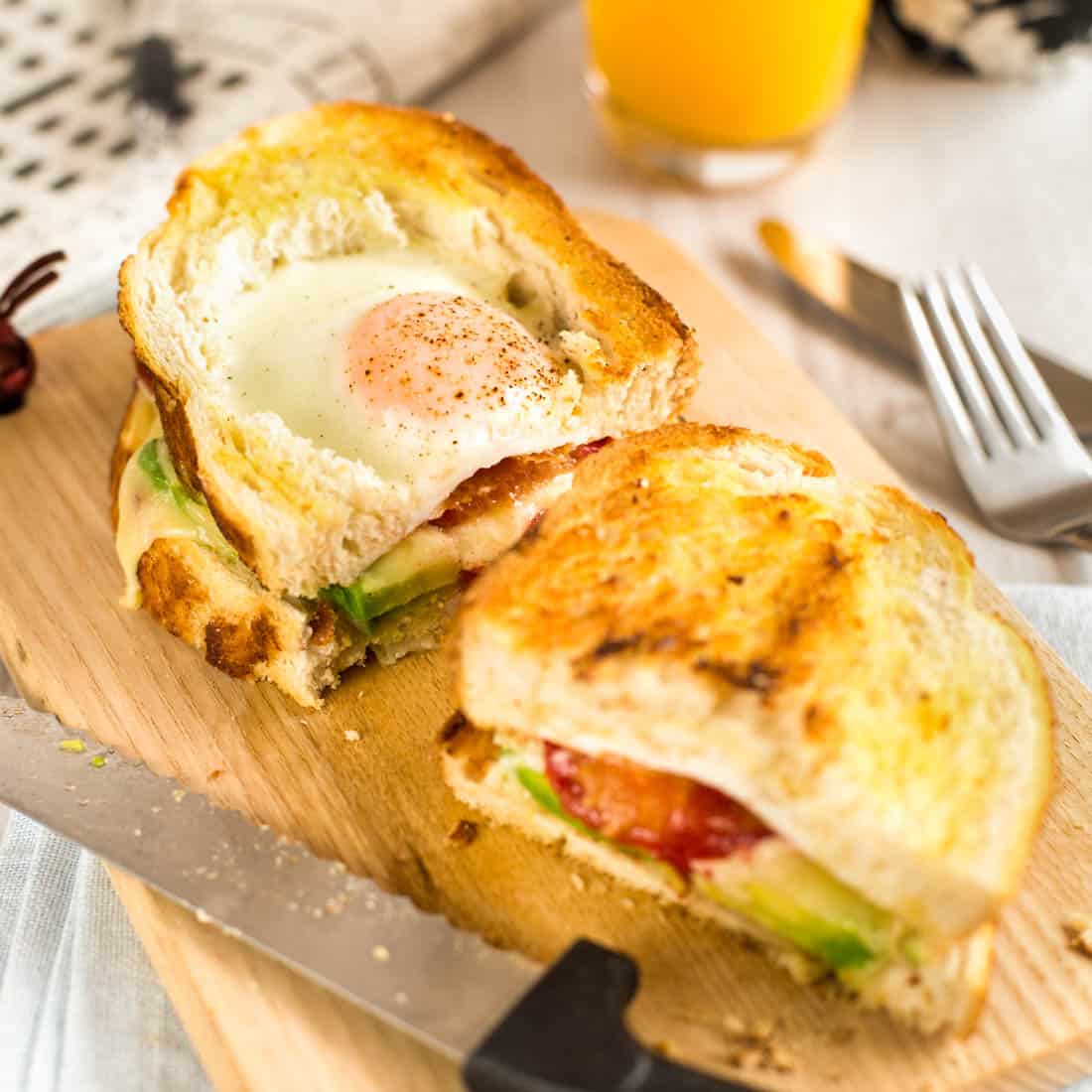 https://www.easycheesyvegetarian.com/wp-content/uploads/2021/11/egg-in-a-hole-breakfast-sandwiches-featured-1.jpg