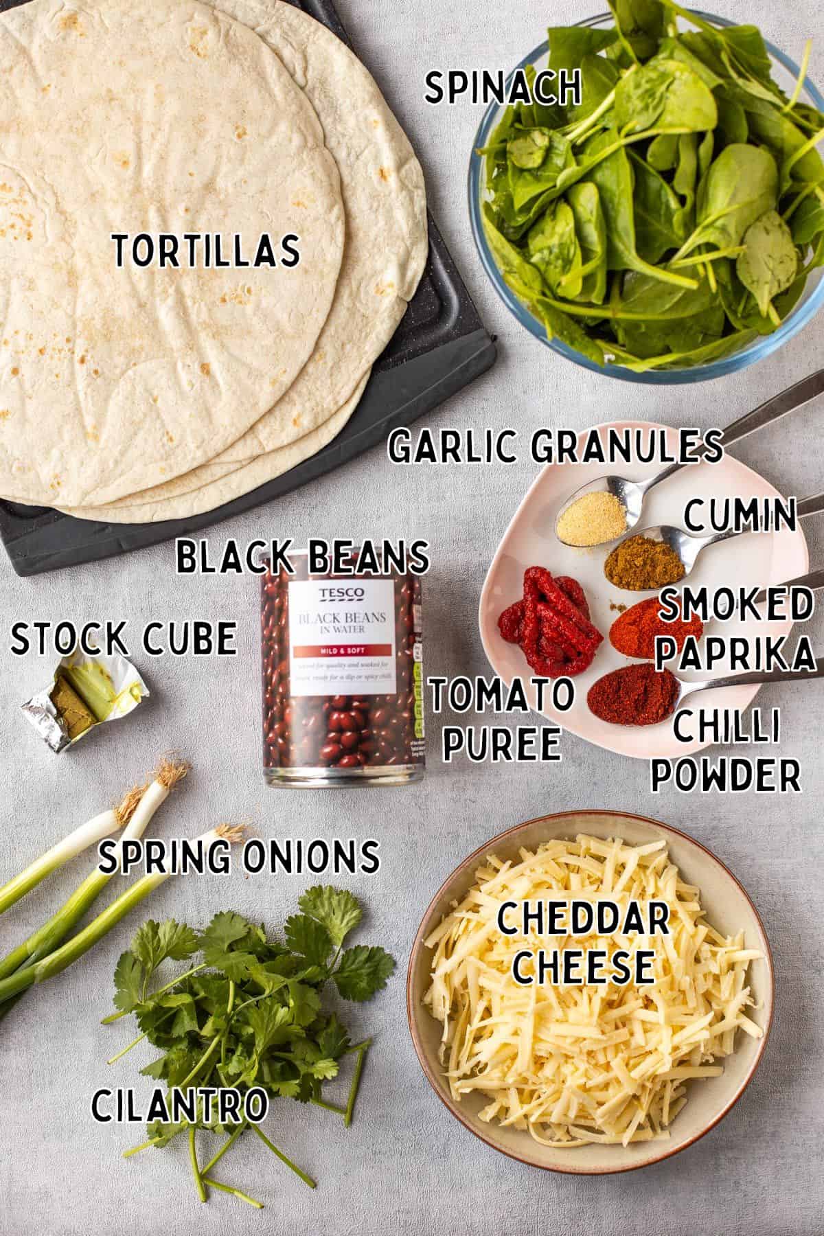 Ingredients for spinach and black bean enchiladas with text overlay.