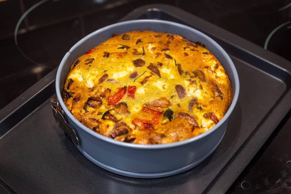 Vegetarian crustless quiche in a springform cake tin.