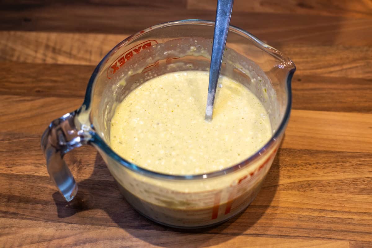 Crustless quiche mixture in a measuring jug.