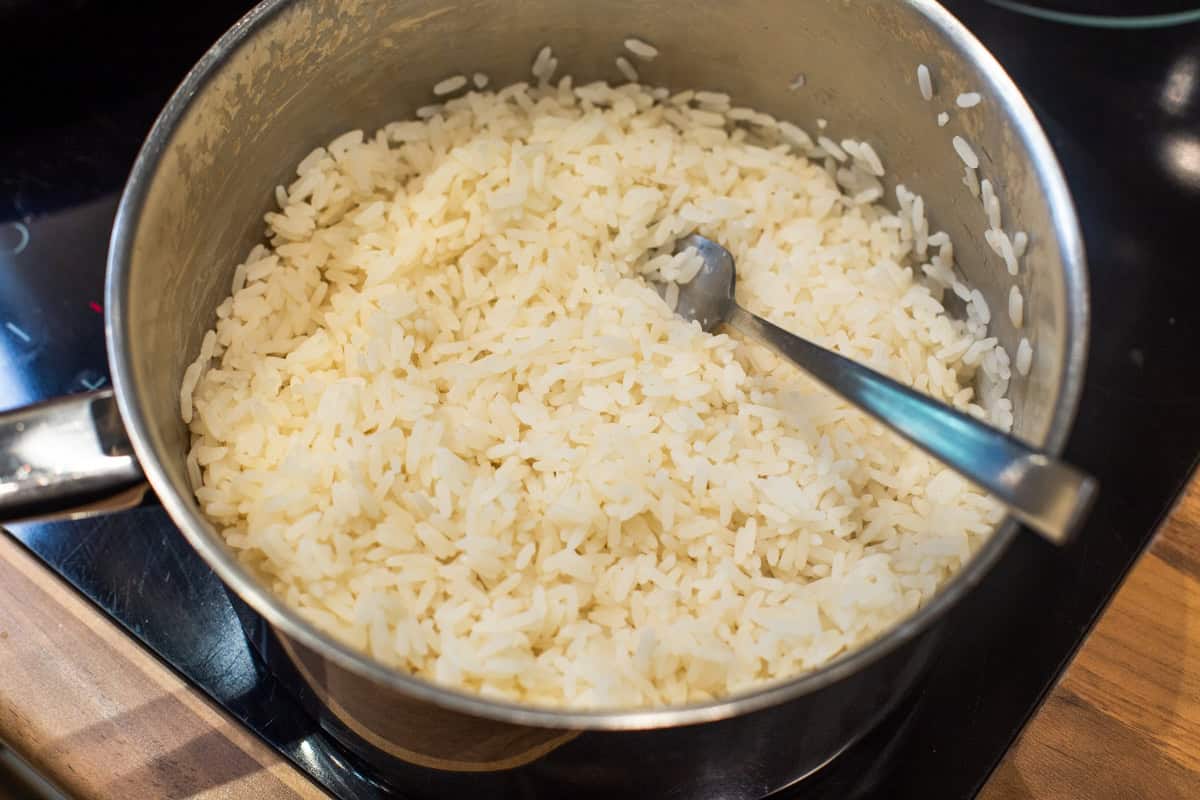 Cooked white rice in a saucepan.