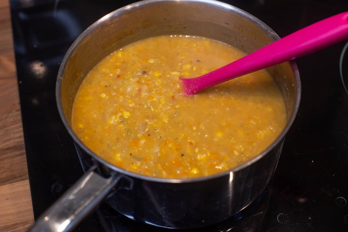 Vegan coconut corn chowder in a saucepan.