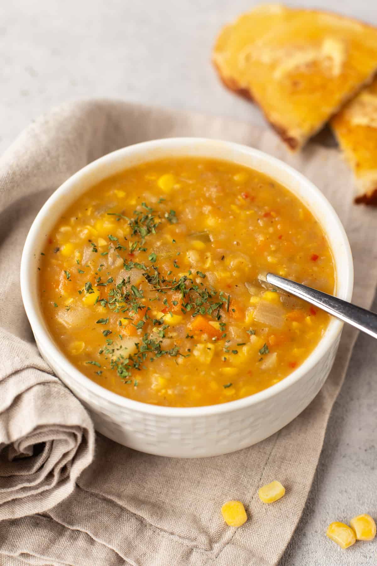 A bowl of vegan corn chowder topped with cilantro.