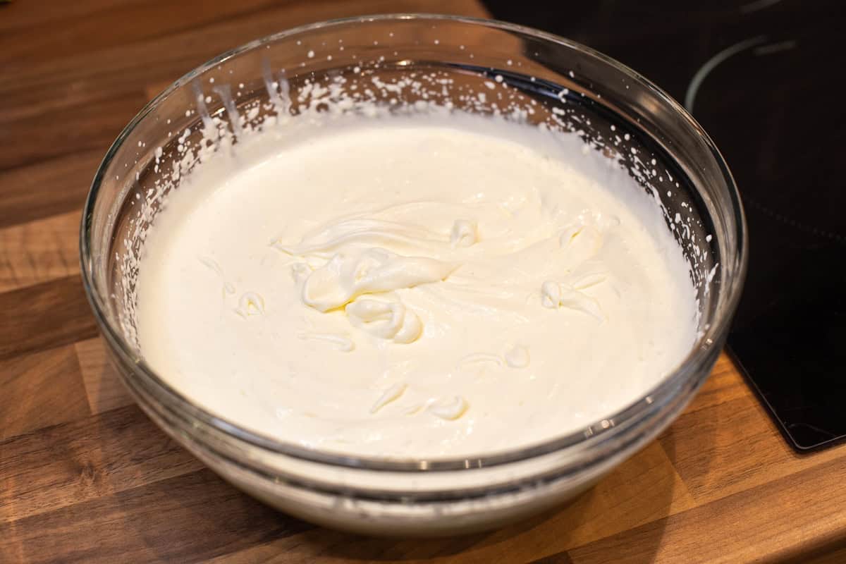 A large bowl of whipped cream and condensed milk.