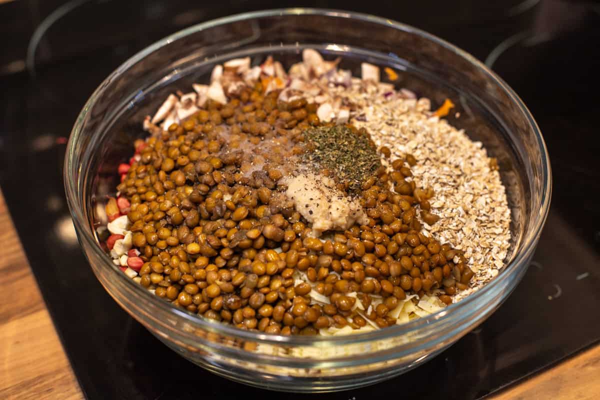 Raw ingredients for nut roast in a large bowl.