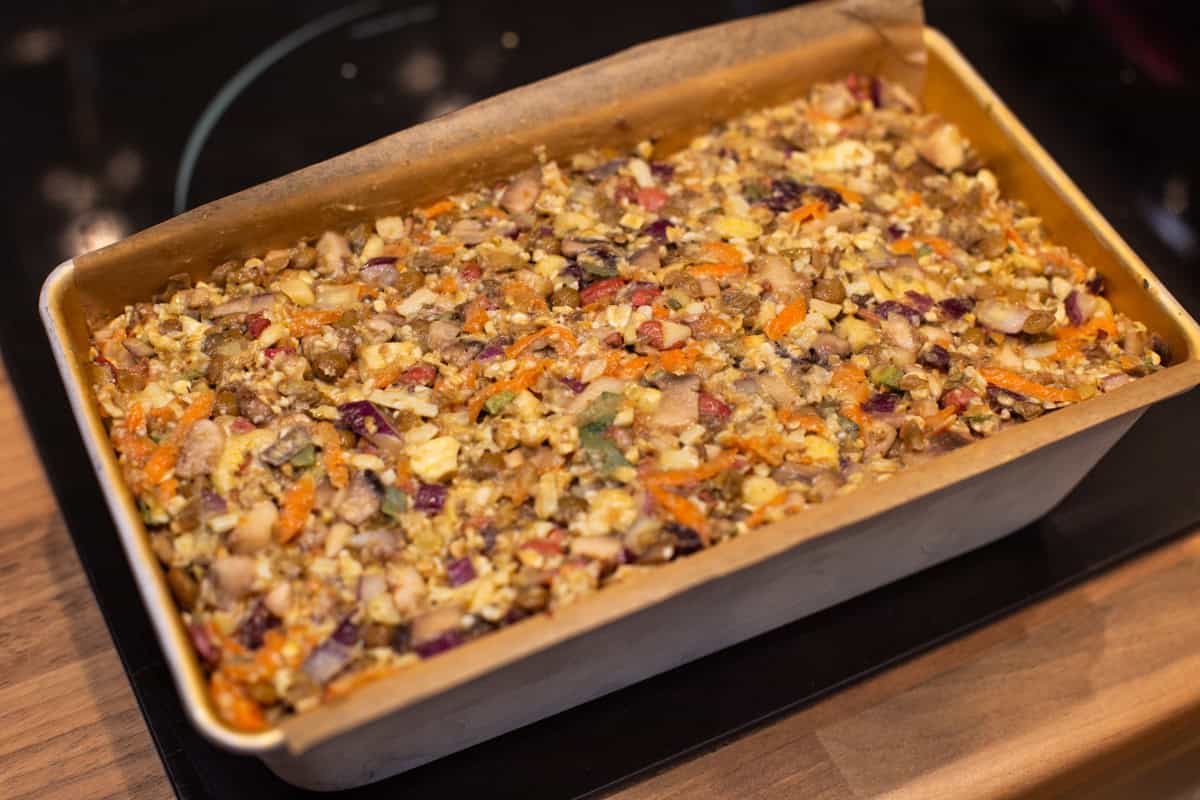 Uncooked nut roast in a loaf tin.