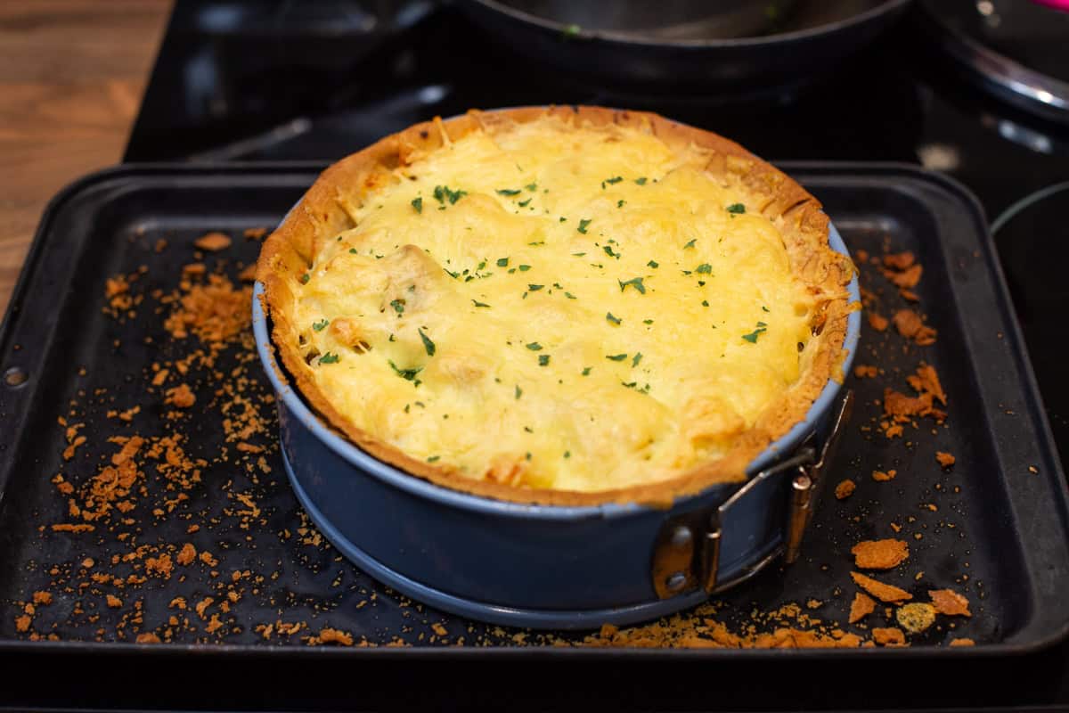 A cheesy pie in a cake tin.