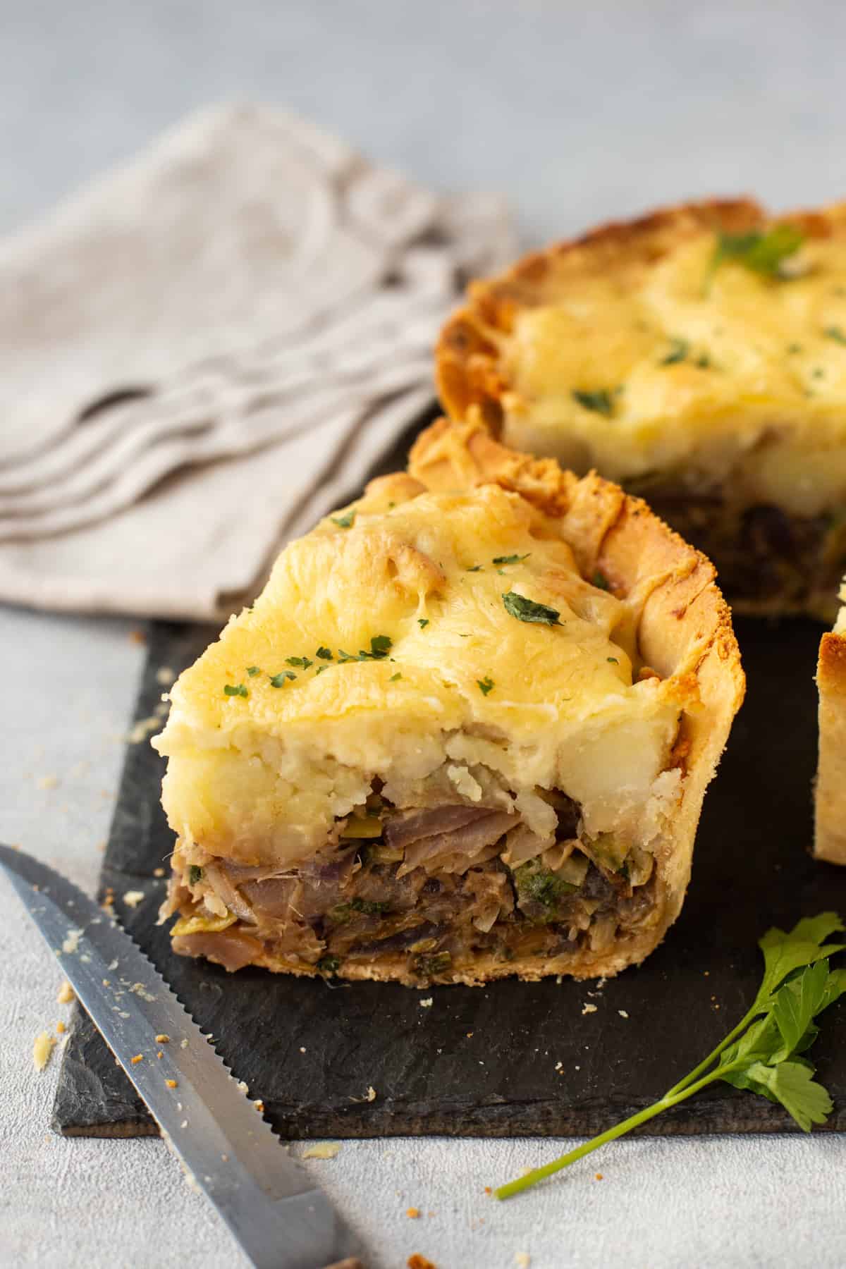 A slice of homity pie with sautéed leeks, potatoes and cheese.