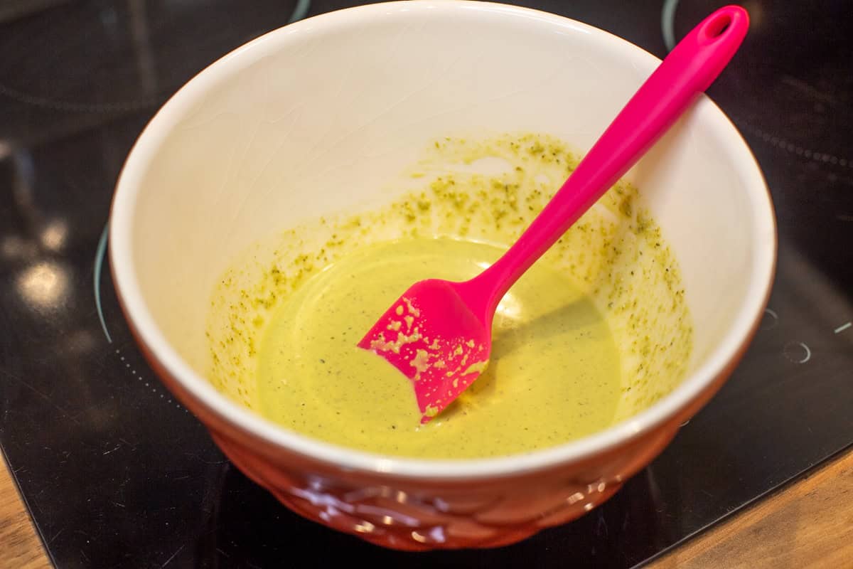 Watered down pesto in a mixing bowl.