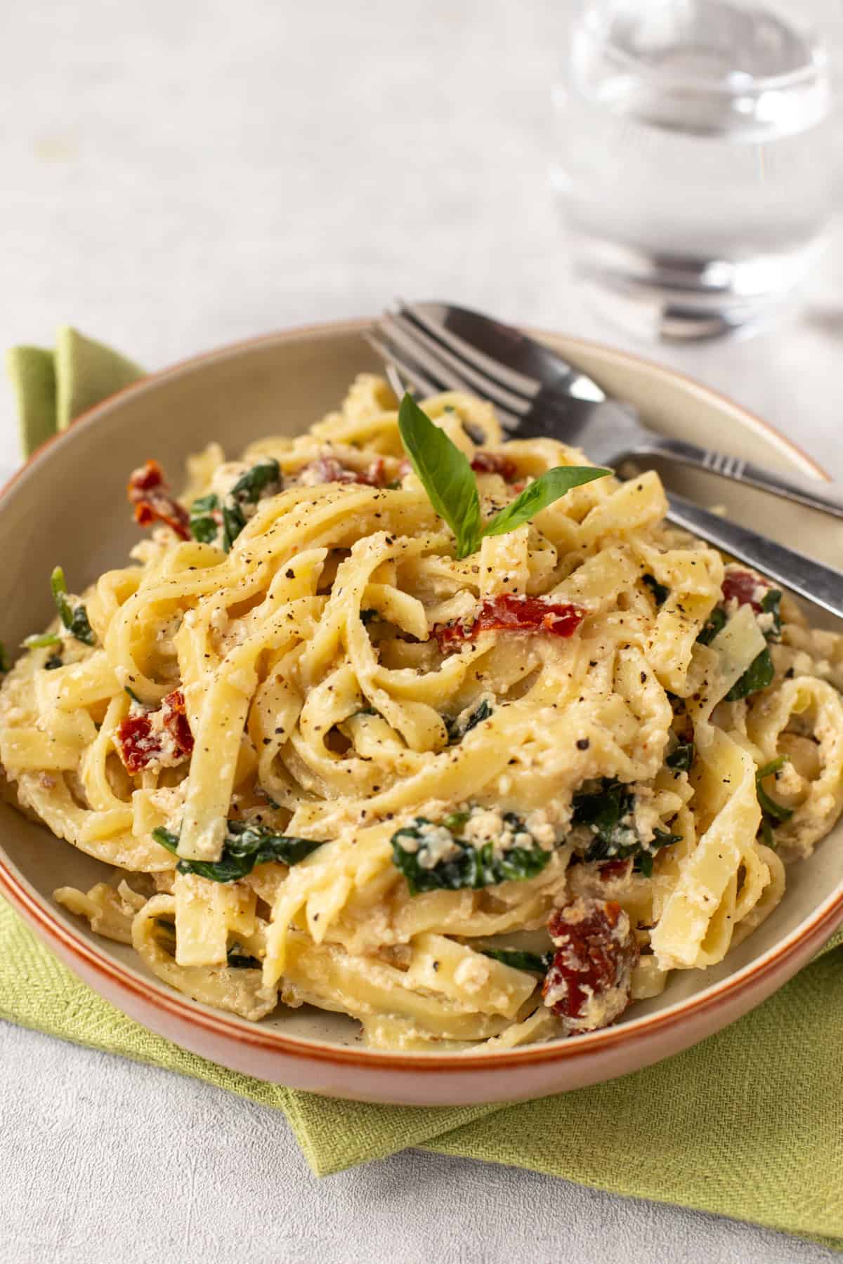 A bowl of tagliatelle with creamy tofu sauce.