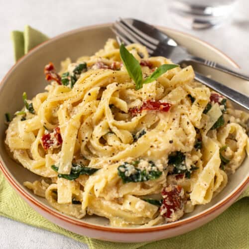 Creamy tofu pasta in a bowl.